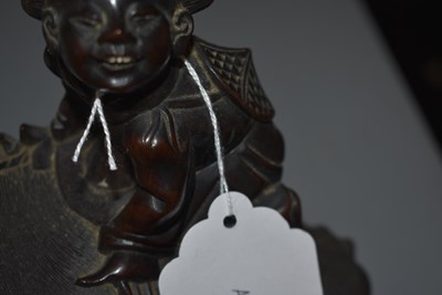 Lot 21 - AN EARLY 20TH CENTURY CHINESE CARVED HARDWOOD FIGURE