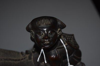 Lot 21 - AN EARLY 20TH CENTURY CHINESE CARVED HARDWOOD FIGURE