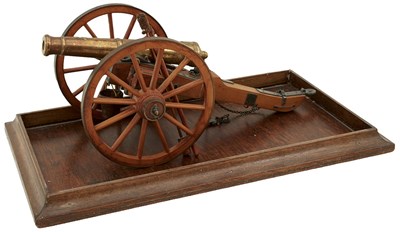 Lot 101 - A CASED MODEL OF AN ARTILLERY PIECE