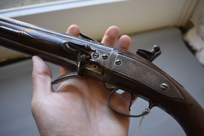 Lot 752 - A 25-BORE DOUBLE BARRELLED FLINTLOCK TURNOVER HOLSTER PISTOL BY WILSON