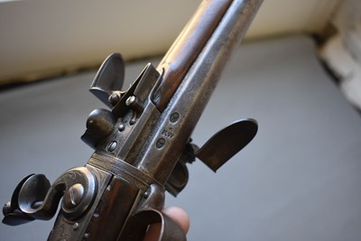 Lot 752 - A 25-BORE DOUBLE BARRELLED FLINTLOCK TURNOVER HOLSTER PISTOL BY WILSON