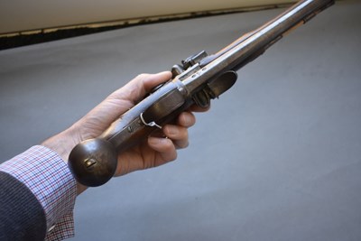 Lot 752 - A 25-BORE DOUBLE BARRELLED FLINTLOCK TURNOVER HOLSTER PISTOL BY WILSON