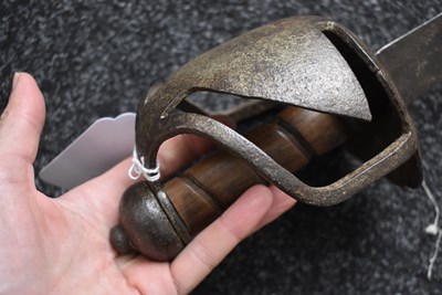 Lot 131 - AN 18TH CENTURY BRITISH MILITARY BASKET HILTED BACKSWORD