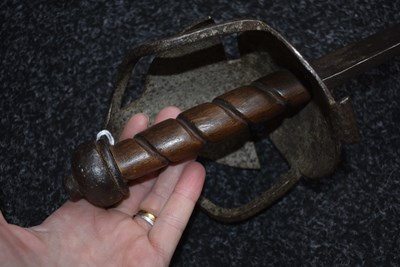Lot 131 - AN 18TH CENTURY BRITISH MILITARY BASKET HILTED BACKSWORD