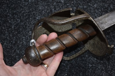 Lot 131 - AN 18TH CENTURY BRITISH MILITARY BASKET HILTED BACKSWORD