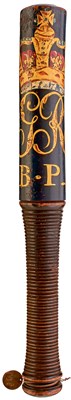 Lot 671 - A GEORGE IV PAINTED WOOD TRUNCHEON