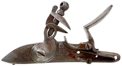 Lot 556 - A BROWN BESS LOCK AND A BOX OF LOCK PARTS