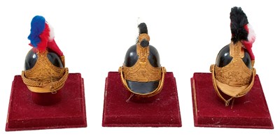 Lot 626 - THREE VARIOUS MODERN MINIATURE HELMETS