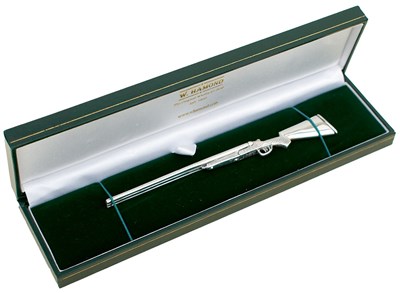 Lot 505 - A SILVER MINIATURE SPORTING GUN