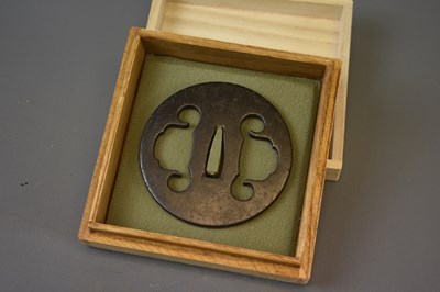 Lot 20 - A CIRCULAR IRON SUKASHI TSUBA