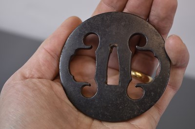 Lot 20 - A CIRCULAR IRON SUKASHI TSUBA