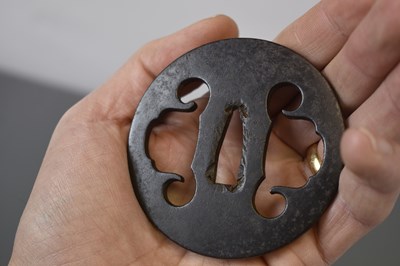 Lot 20 - A CIRCULAR IRON SUKASHI TSUBA
