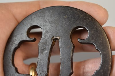 Lot 20 - A CIRCULAR IRON SUKASHI TSUBA