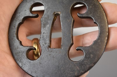 Lot 20 - A CIRCULAR IRON SUKASHI TSUBA