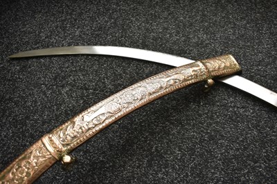 Lot 46 - A 19TH CENTURY SIKH SHAMSHIR SHIKARGAR