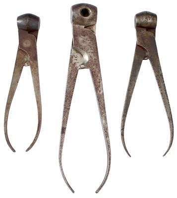 Lot A GROUP OF FOUR SCISSOR BALL MOULDS
