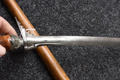 Lot 25 - A LATE 19TH OR EARLY 20TH CENTURY INDONESIAN PANJANG OR EXECUTIONER'S KRIS