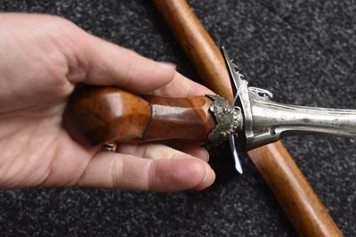 Lot 25 - A LATE 19TH OR EARLY 20TH CENTURY INDONESIAN PANJANG OR EXECUTIONER'S KRIS