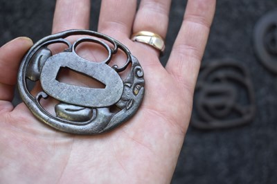 Lot 12 - A SMALL COLLECTION OF FIVE JAPANESE ARCHAIC IRON TSUBA
